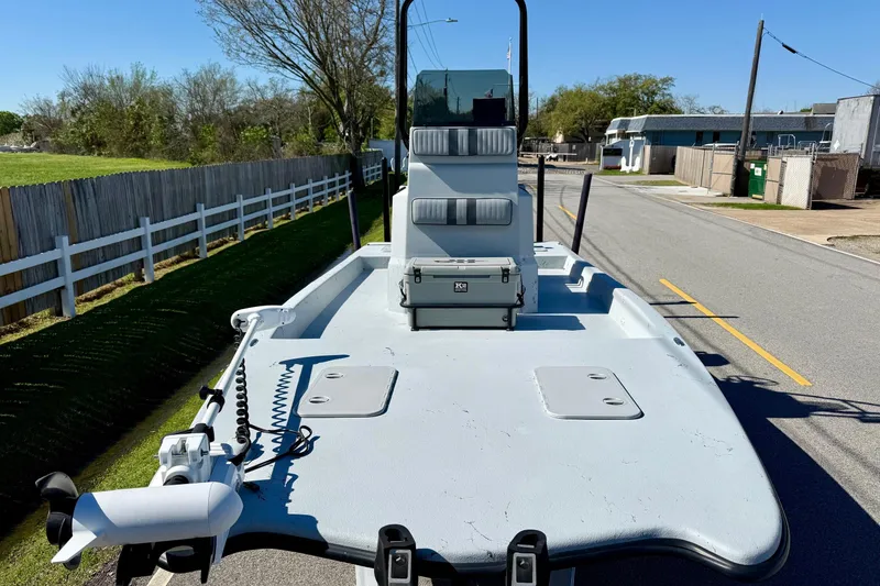 Slide: The Image of JH Performance boat on trailer, featuring a trolling motor and storage compartments. - 6