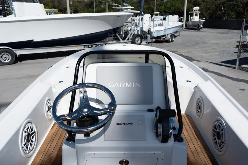 Slide: The Image of 2020 Yellowfin 21 Hybrid boat dashboard with Garmin and Mercury controls. - 6