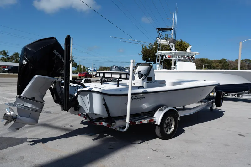 Slide: The Image of 2020 Yellowfin 21 Hybrid boat on trailer with Mercury outboard motor. - 8