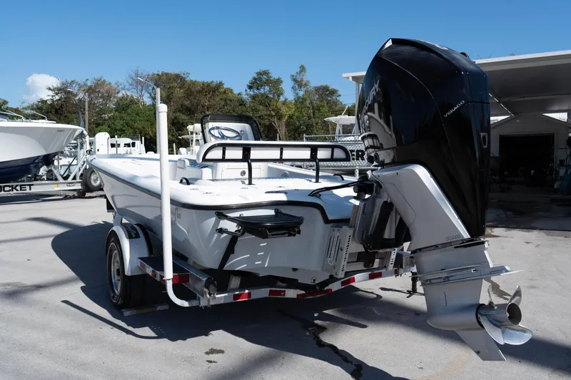 Slide: The Image of 2020 Yellowfin 21 Hybrid boat with powerful outboard motor on trailer. - 9
