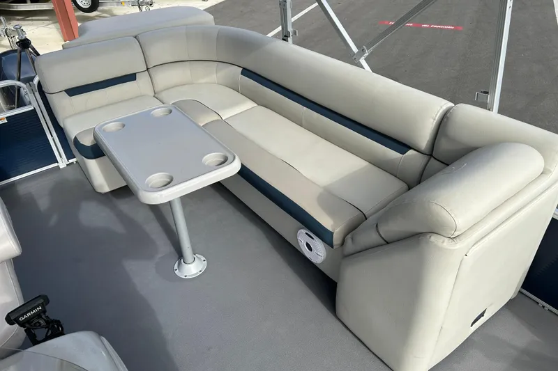 Slide: The Image of Luxurious seating area on 2020 Godfrey SR 206 C boat with table and cup holders. - 10