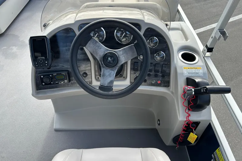 Slide: The Image of Steering console of 2020 Godfrey SR 206 C boat with gauges and controls. - 12
