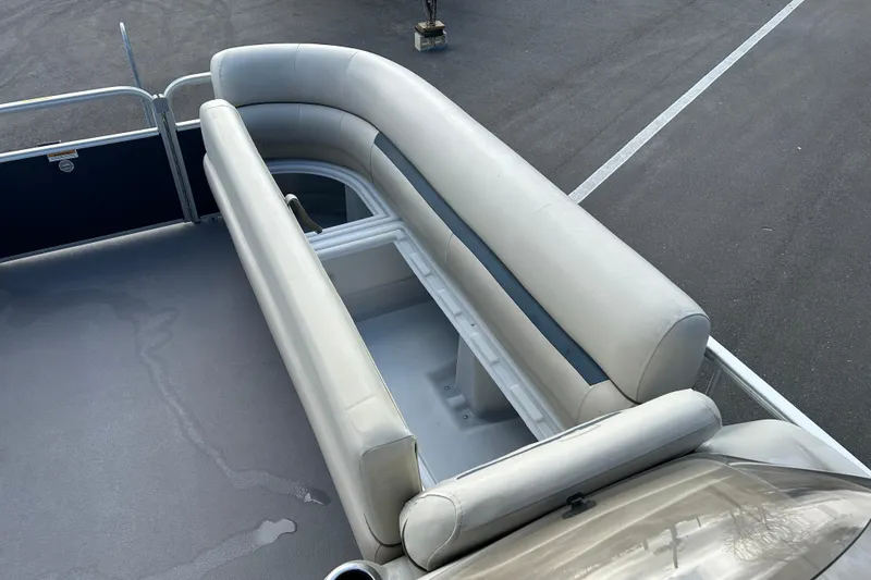 Slide: The Image of 2020 Godfrey SR 206 C boat with beige seating and storage compartment. - 14