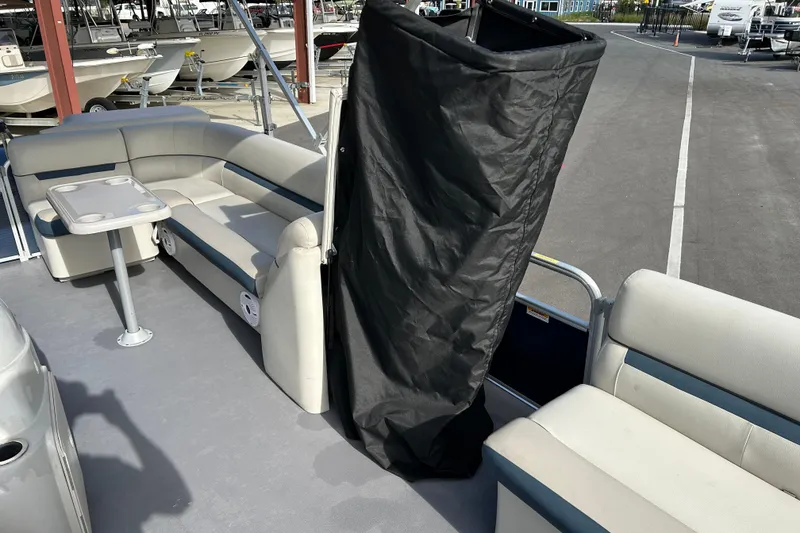 Slide: The Image of 2020 Godfrey SR 206 C pontoon boat interior with seating and table. - 15