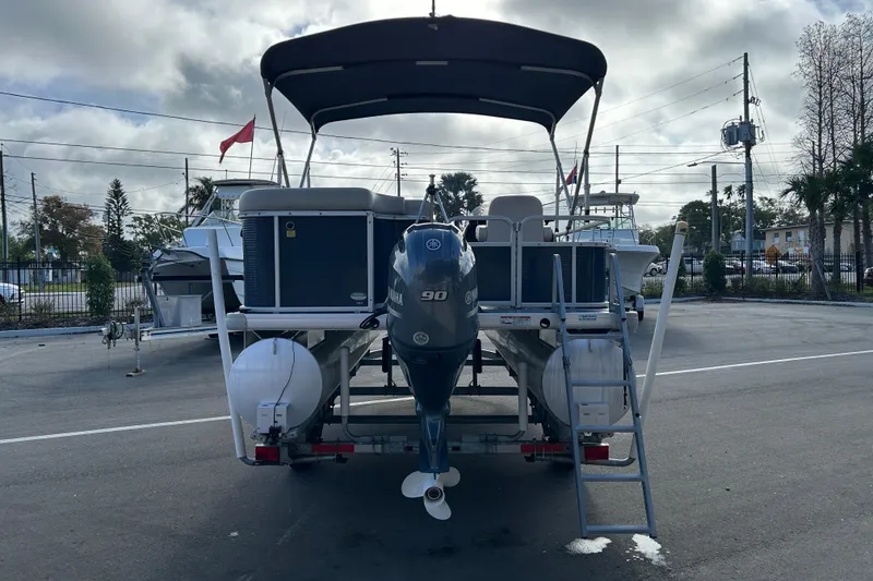 Slide: The Image of 2020 Godfrey SR 206 C pontoon boat with Yamaha 90 engine, parked outdoors. - 3
