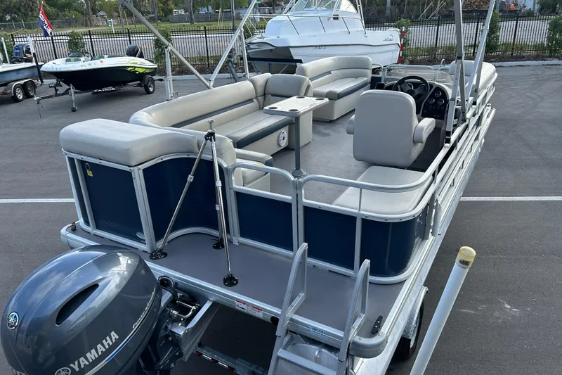 Slide: The Image of 2020 Godfrey SR 206 C pontoon boat with Yamaha motor, parked on pavement. - 7