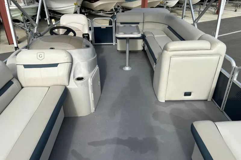 Slide: The Image of Interior of a 2020 Godfrey SR 206 C pontoon boat with seating and steering console. - 9