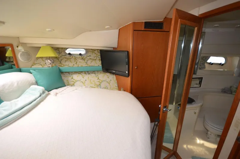 Slide: The Image of Interior of Bayliner 3988 Motoryacht, bedroom with ensuite bathroom. - 12