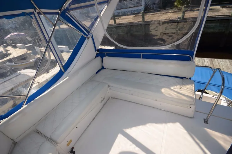 Slide: The Image of Bayliner 3988 Command Bridge Motoryacht 1998, seating area with blue and white cushions. - 26