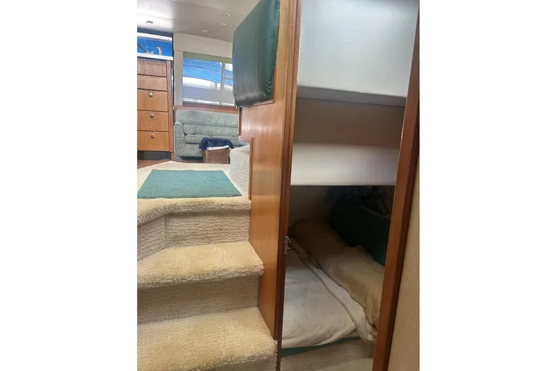 Slide: The Image of Interior of 1998 Bayliner 3988 Command Bridge Motoryacht with cozy cabin and stairs. - 34