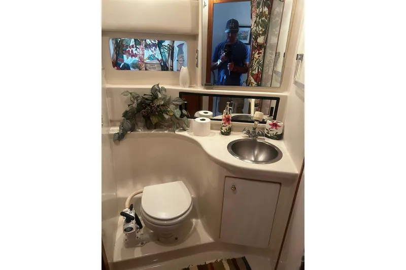 Slide: The Image of Bathroom interior of 1998 Bayliner 3988 Command Bridge Motoryacht with sink and toilet. - 36