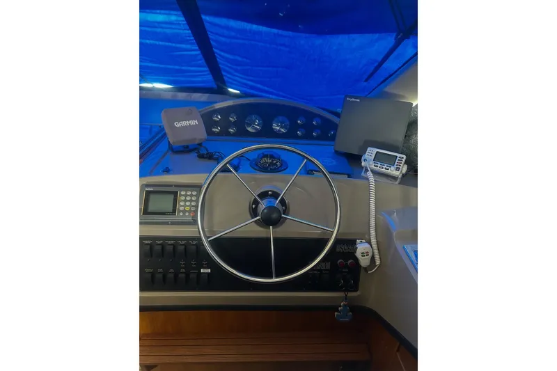 Slide: The Image of 1998 Bayliner 3988 Command Bridge Motoryacht helm with Garmin navigation and communication equipment. - 38