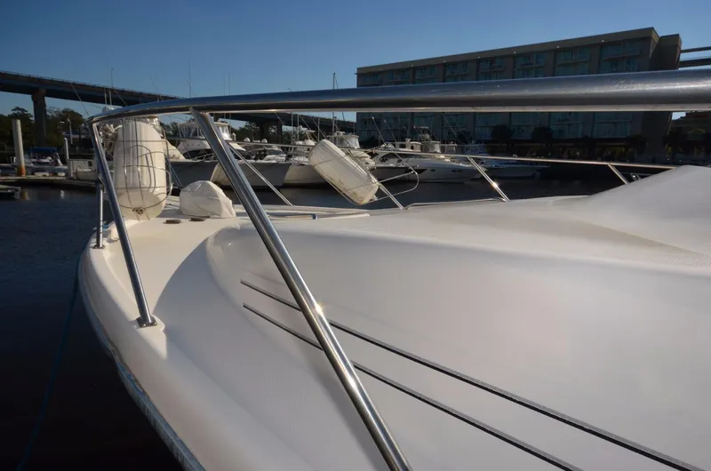 Slide: The Image of 1998 Bayliner 3988 Motoryacht docked, side view. - 4