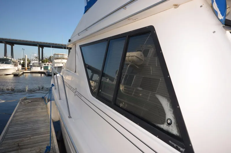 Slide: The Image of 1998 Bayliner 3988 Command Bridge Motoryacht docked. - 5