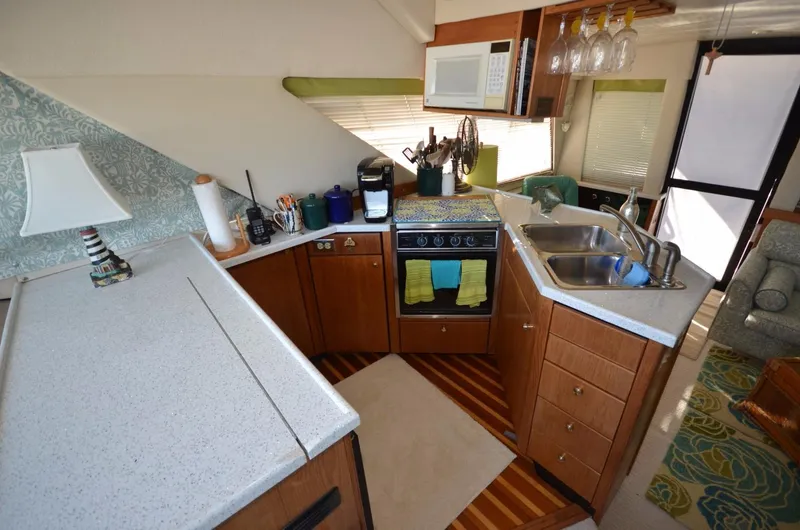 Slide: The Image of Bayliner 3988 Motoryacht kitchen, 1998 model, featuring modern amenities. - 8