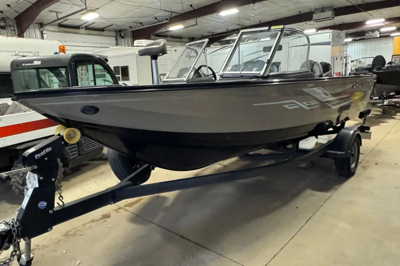 The Image of 2020 Crestliner 1850 Super Hawk boat on trailer in indoor storage facility. - 1