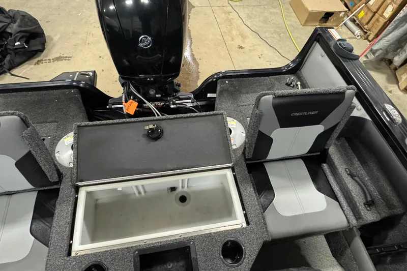 Slide: The Image of 2020 Crestliner 1850 Super Hawk boat interior with seating and storage compartments. - 13