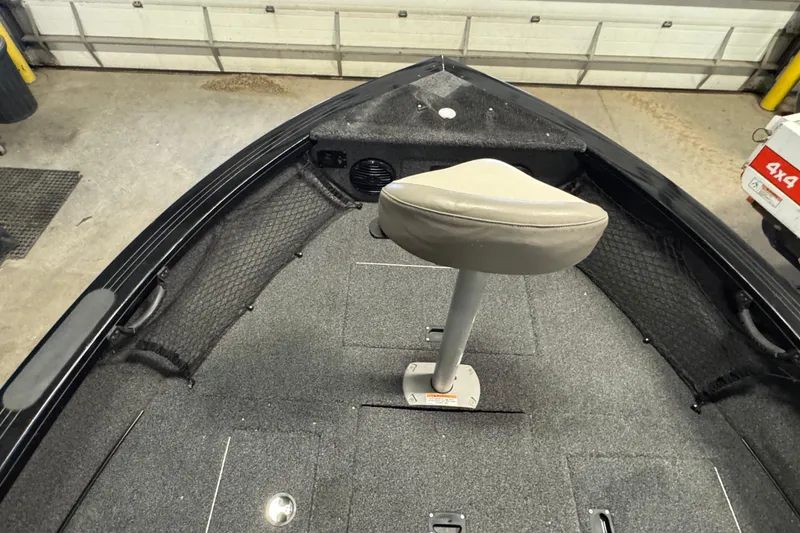 Slide: The Image of 2020 Crestliner 1850 Super Hawk boat interior with swivel seat and storage compartments. - 16