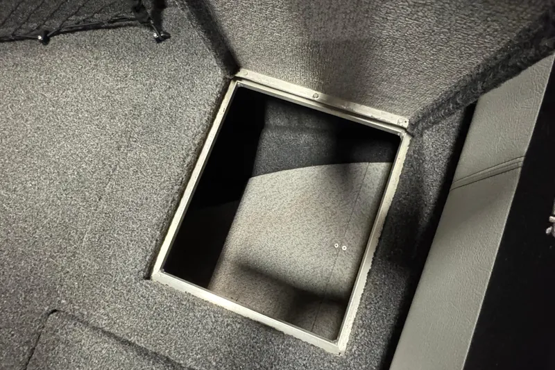 Slide: The Image of Carpeted storage compartment in 2020 Crestliner 1850 Super Hawk boat. - 17