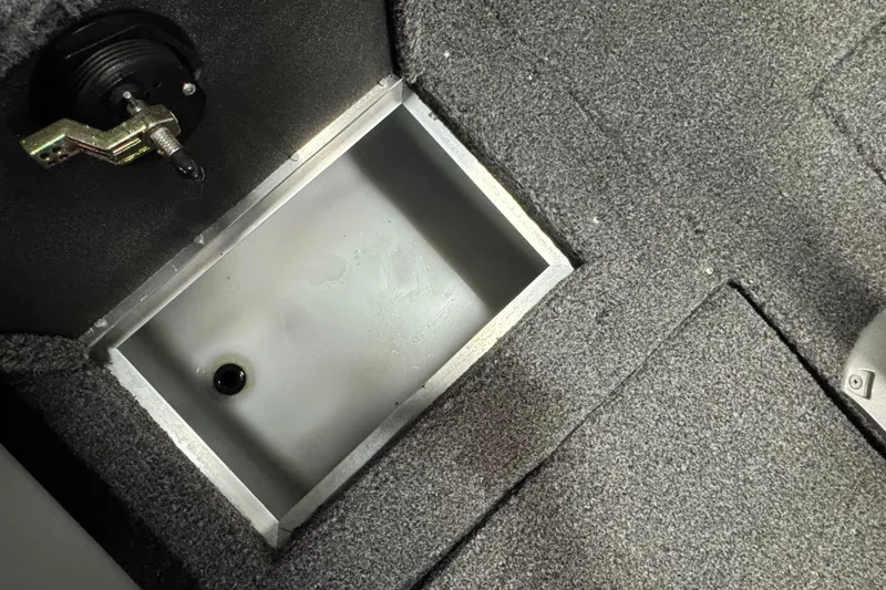 Slide: The Image of Carpeted storage compartment in 2020 Crestliner 1850 Super Hawk boat interior. - 18