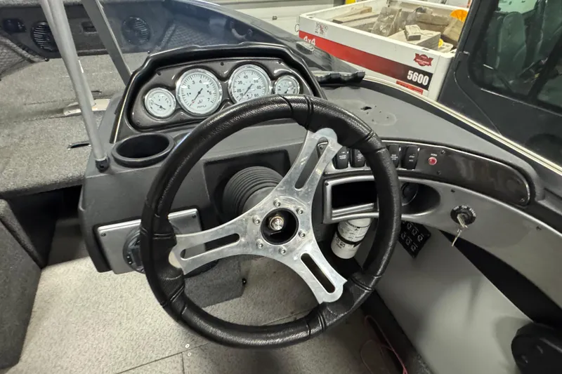 Slide: The Image of 2020 Crestliner 1850 Super Hawk dashboard with steering wheel and gauges. - 8