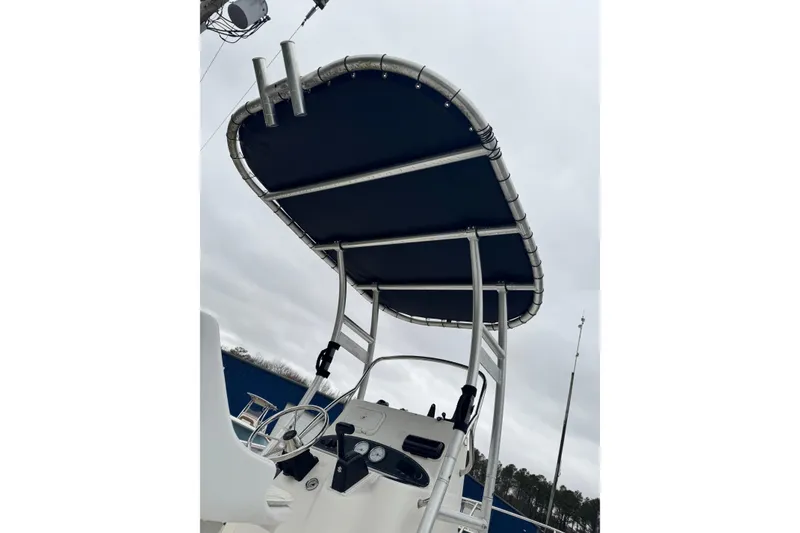 Slide: The Image of 2005 Boston Whaler 190 Nantucket boat with T-top and control console. - 11