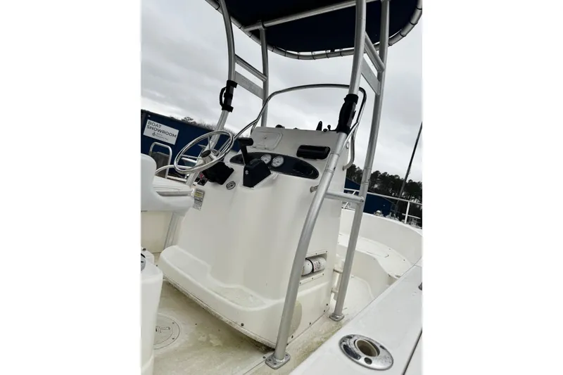 Slide: The Image of 2005 Boston Whaler 190 Nantucket boat console with steering wheel and gauges. - 12