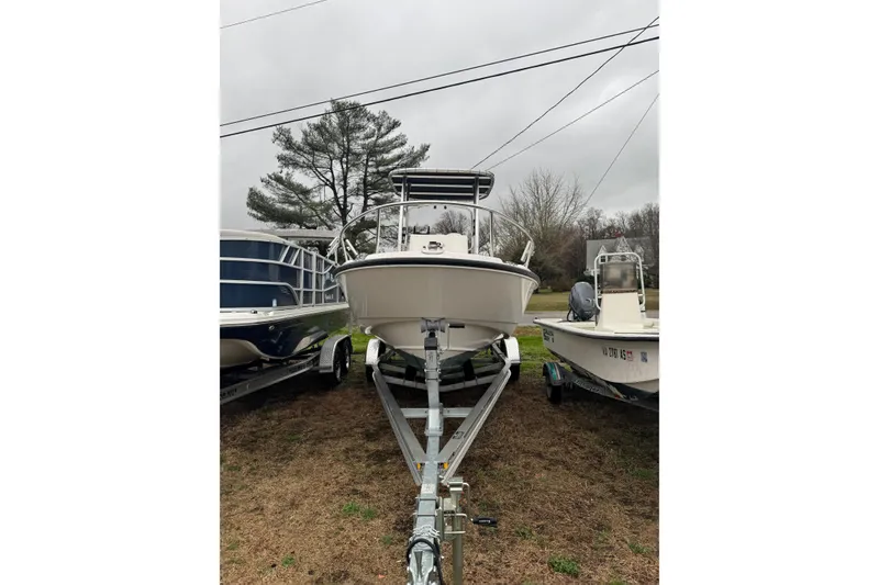Slide: The Image of 2005 Boston Whaler 190 Nantucket boat on trailer, parked outdoors. - 2
