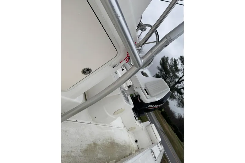 Slide: The Image of 2005 Boston Whaler 190 Nantucket boat with Suzuki outboard motor, side view. - 7