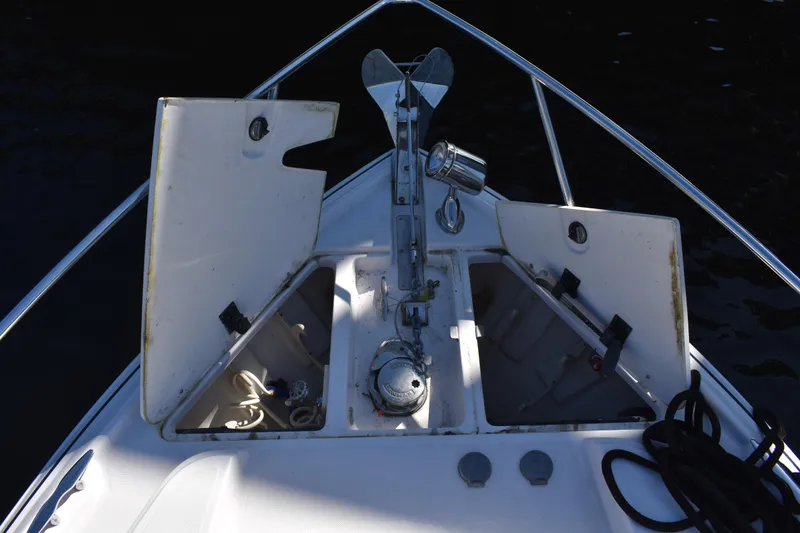 Slide: The Image of Bow of 2020 Regal 35 Sport Coupe with anchor and storage compartments open. - 19