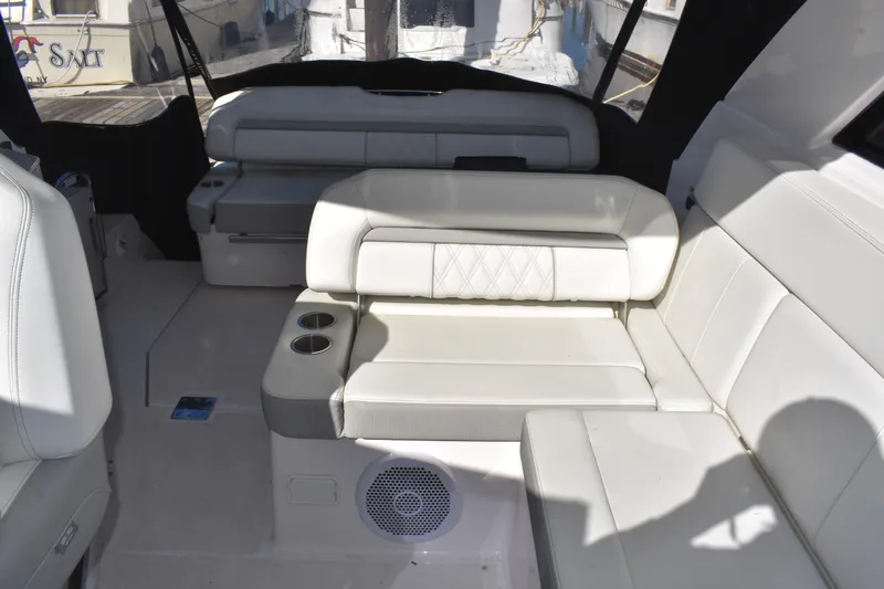 Slide: The Image of 2020 Regal 35 Sport Coupe interior with white leather seating and cup holders. - 25