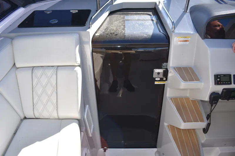 Slide: The Image of 2020 Regal 35 Sport Coupe interior with white seating and modern control panel. - 26