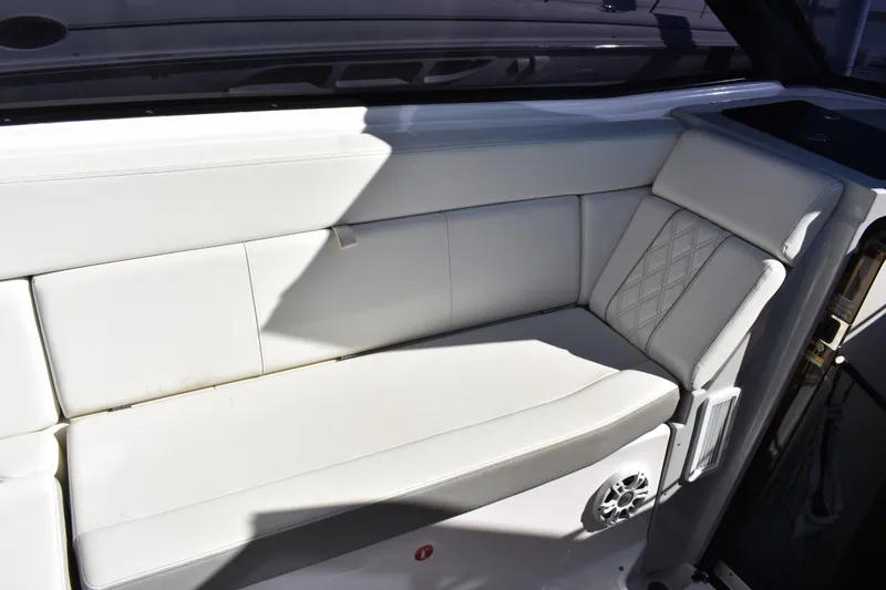 Slide: The Image of White leather seating on 2020 Regal 35 Sport Coupe boat interior. - 27