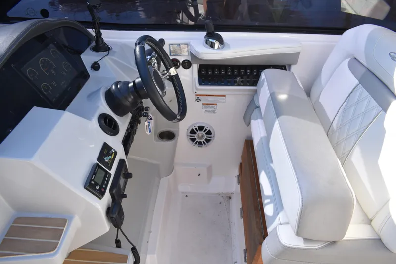 Slide: The Image of Cockpit of 2020 Regal 35 Sport Coupe with steering wheel and control panel. - 29