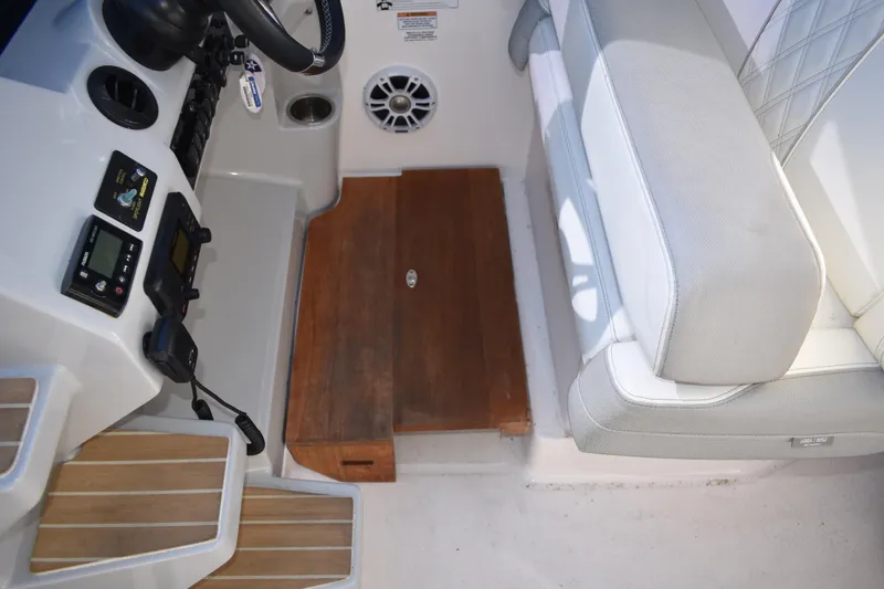 Slide: The Image of 2020 Regal 35 Sport Coupe helm area with controls and seating. - 31