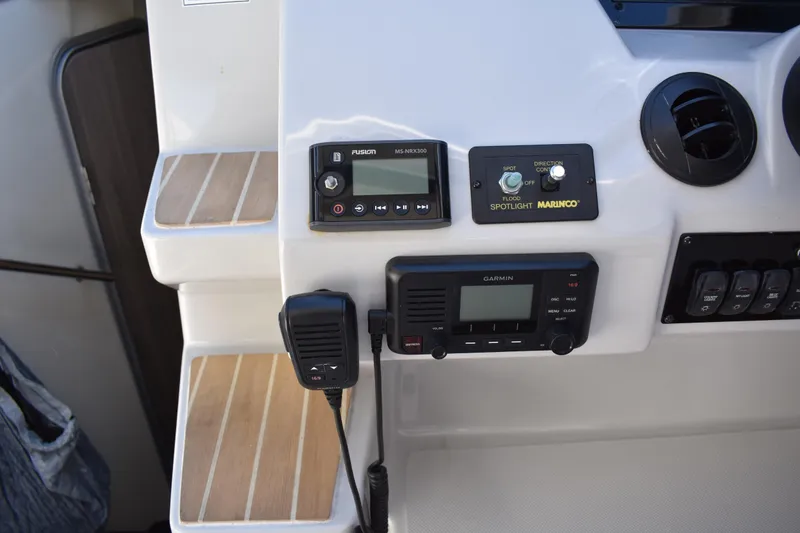 Slide: The Image of Control panel of a 2020 Regal 35 Sport Coupe with navigation and communication devices. - 34