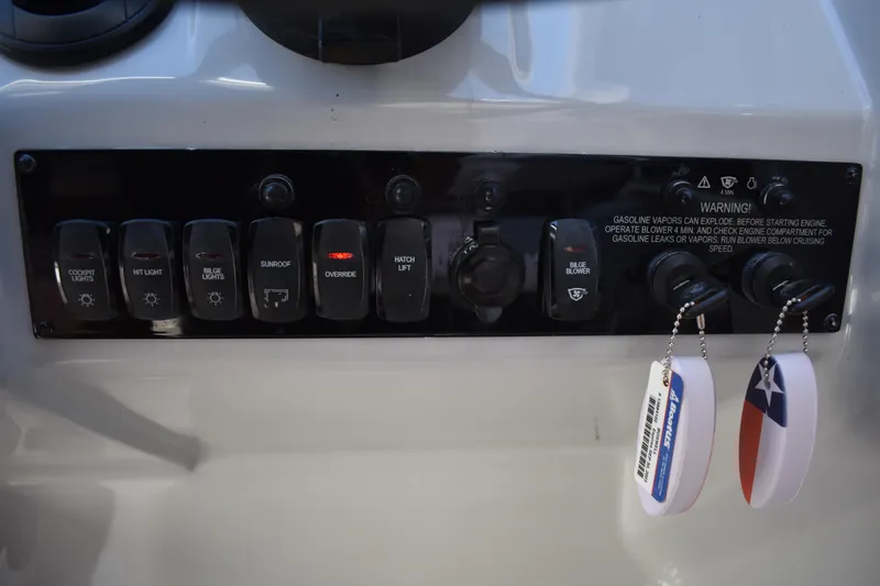 Slide: The Image of Control panel of a 2020 Regal 35 Sport Coupe with labeled switches and warning notice. - 36