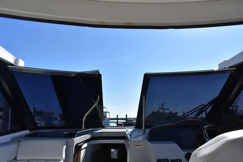Slide: The Image of Interior view of 2020 Regal 35 Sport Coupe boat cockpit with open roof. - 41