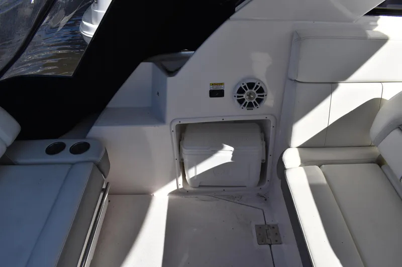 Slide: The Image of Interior of 2020 Regal 35 Sport Coupe with white seating and storage compartment. - 45