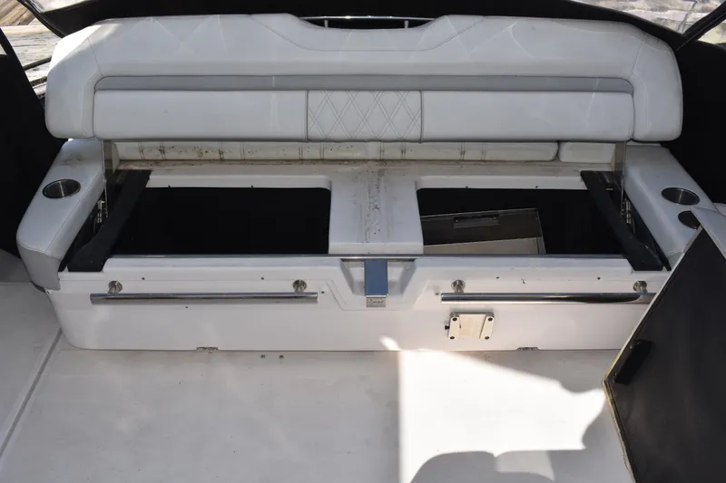 Slide: The Image of 2020 Regal 35 Sport Coupe boat interior storage compartment with open seating area. - 46
