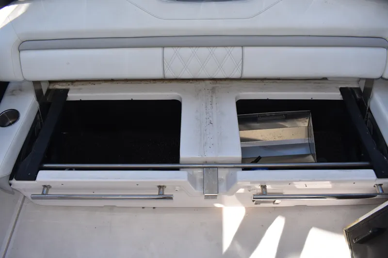 Slide: The Image of Open storage compartment on a 2020 Regal 35 Sport Coupe boat. - 47