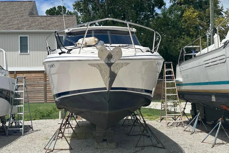 Slide: The Image of 2020 Regal 35 Sport Coupe boat on calm water, side view. - 5