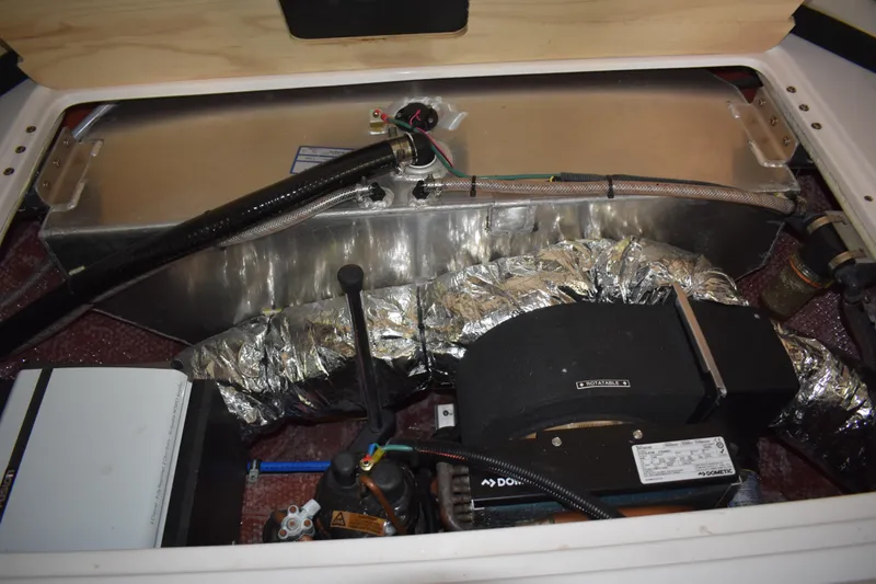 Slide: The Image of Engine compartment of a 2020 Regal 35 Sport Coupe, showcasing mechanical components and wiring. - 62