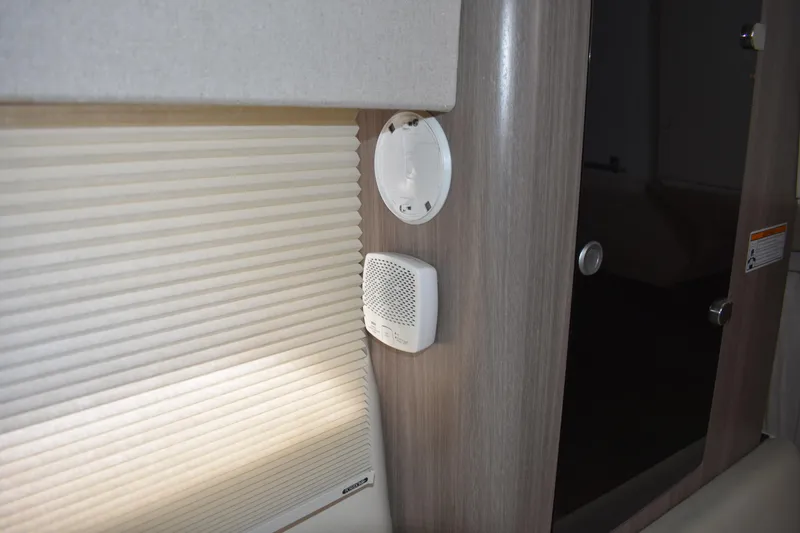 Slide: The Image of Interior of 2020 Regal 35 Sport Coupe with window shade and wall-mounted speaker. - 75