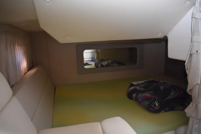 Slide: The Image of 2020 Regal 35 Sport Coupe cabin interior with bed and mirror. - 77