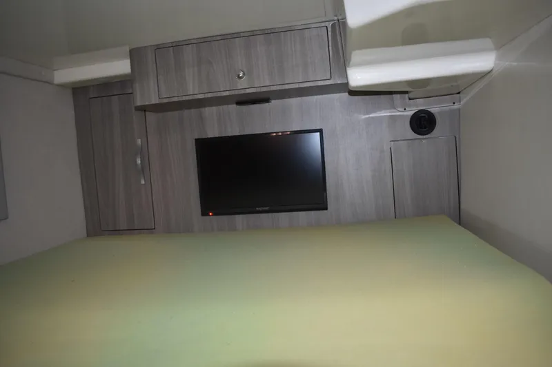 Slide: The Image of Interior cabin of 2020 Regal 35 Sport Coupe with TV and storage cabinets. - 78