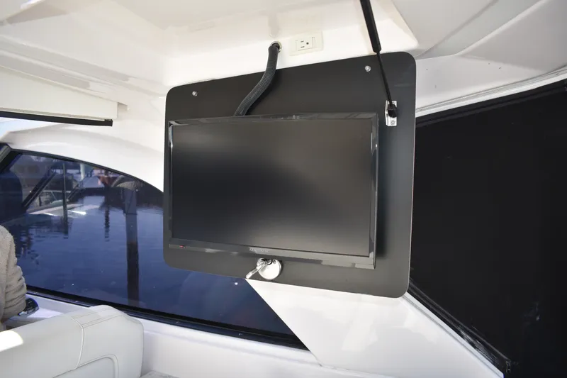 Slide: The Image of Flat-screen TV mounted inside 2020 Regal 35 Sport Coupe yacht. - 87
