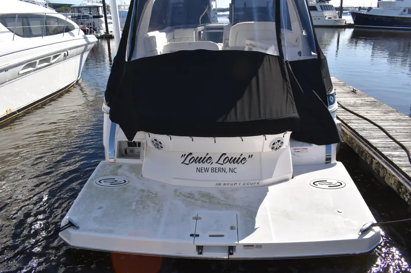 Slide: The Image of 2020 Regal 35 Sport Coupe docked, rear view with black cover, New Bern, NC. - 90