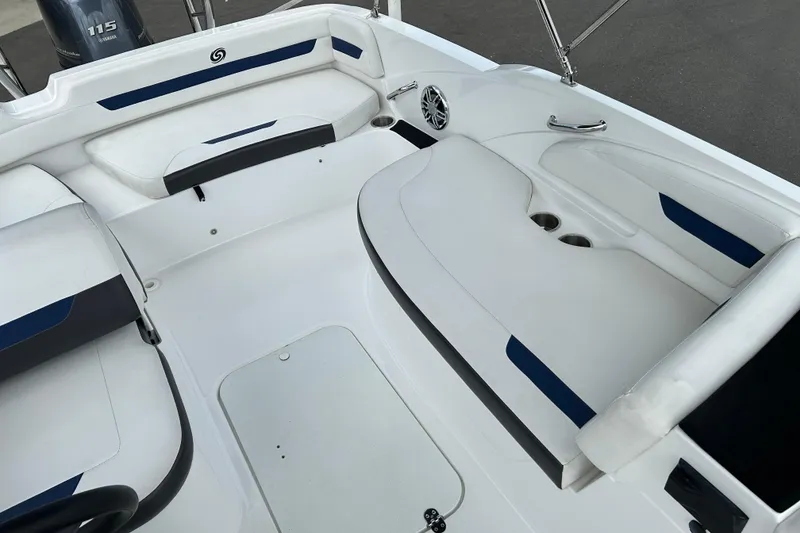 Slide: The Image of 2022 Hurricane SunDeck Sport 185 OB interior with white seating and blue accents. - 10