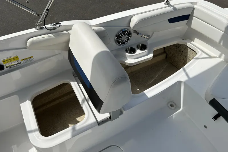 Slide: The Image of 2022 Hurricane SunDeck Sport 185 OB boat interior with seating and cup holders. - 15